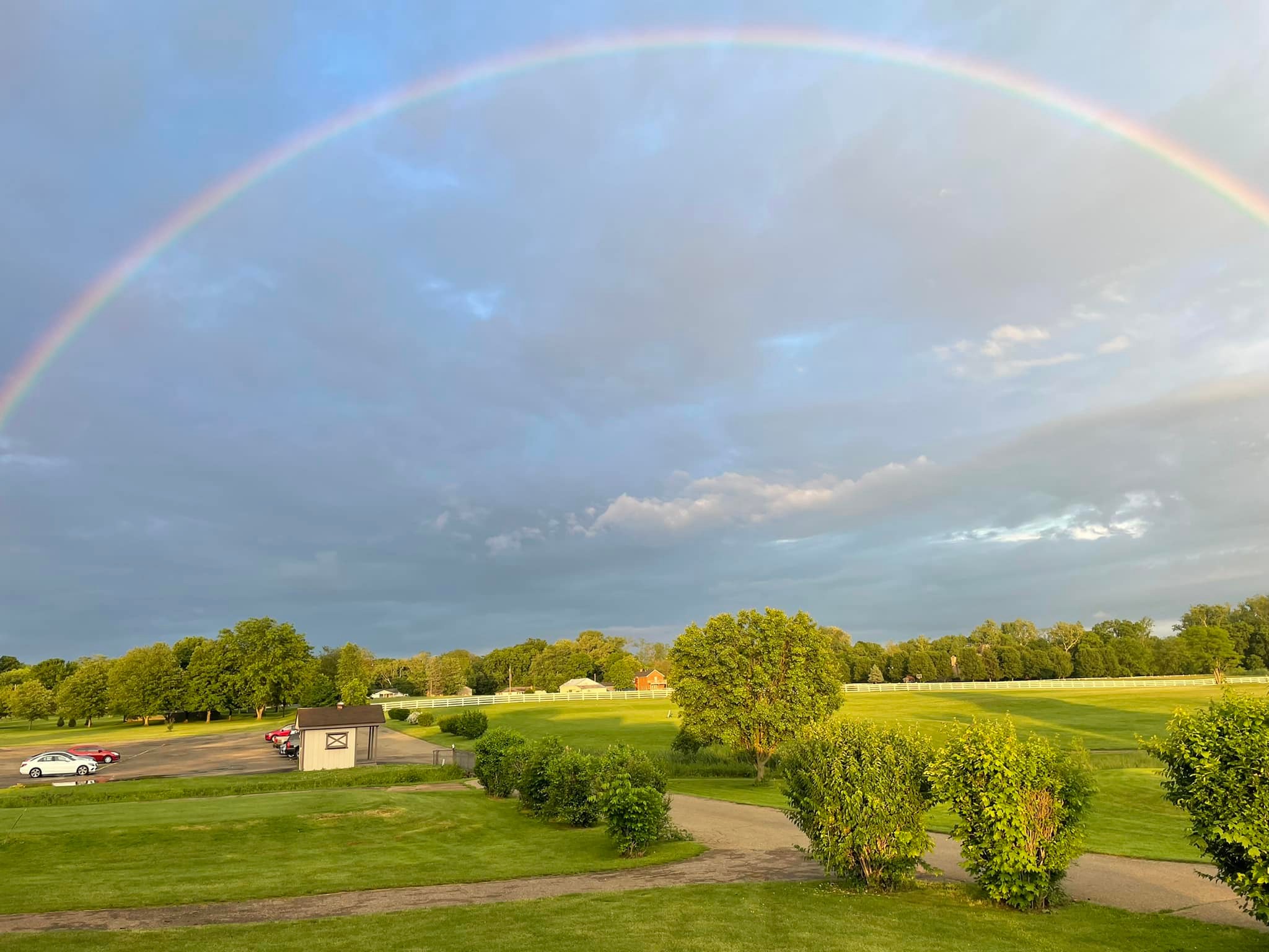 Image of golf ball on tee on grass.